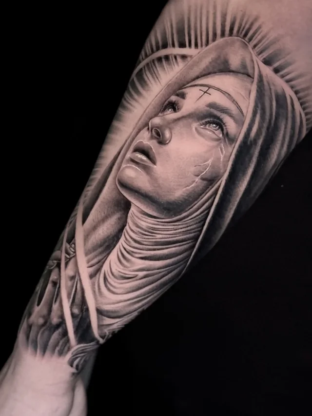 Veiled female figure looking upward with a forehead cross and dark radiating background.