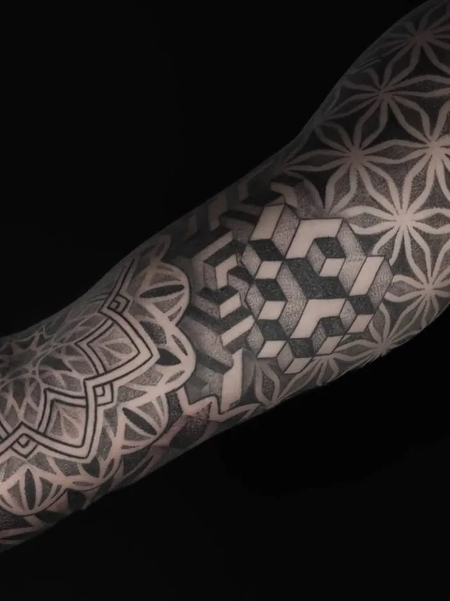Angled close view of the cube pattern connecting to a mandala in the same arm sleeve.