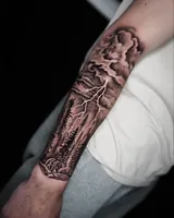 Full forearm angle showing the storm clouds, lightning and forest composition. Artwork by William Martz.