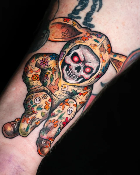 Close view of the colorful matryoshka tattoo on the forearm. Artwork by William Martz.