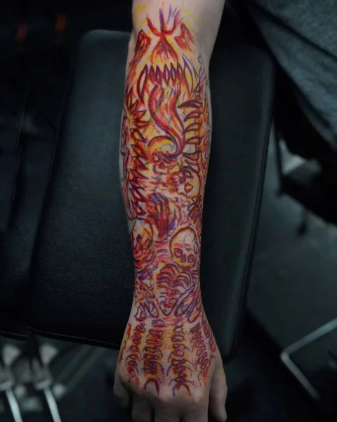 Stencil stage of the ornamental forearm design, showing its placement and flowing outline. Artwork by William Martz.