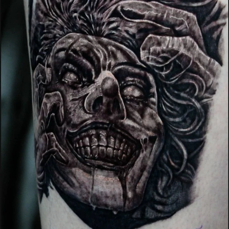 A dark black-and-gray skull portrait surrounded by curling shapes and textured shadows.