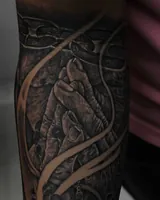 Detail of the clasped hands above the clock in the black-and-gray tattoo. Artwork by William Martz.