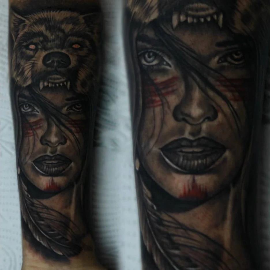 A black-and-gray portrait with a bear headdress, long hair, and dark facial markings.