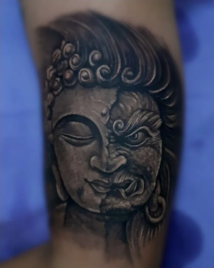A black-and-gray composition combining the serene face of Buddha with the contrasting face of Mara.
