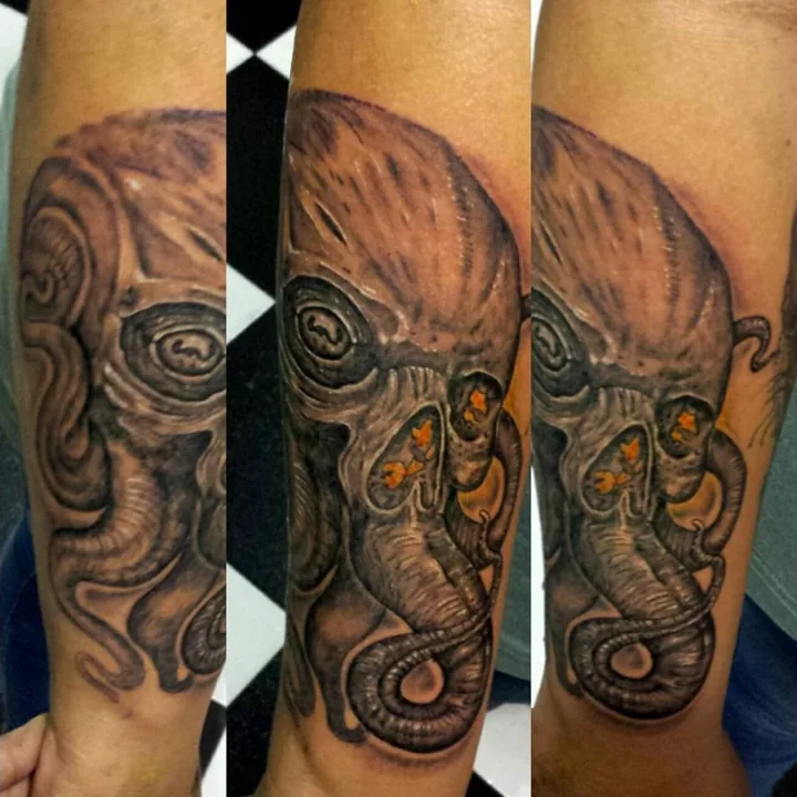 A samurai-inspired mask tattoo with warm brown shading, a long curved nose, and decorative metal-like details.