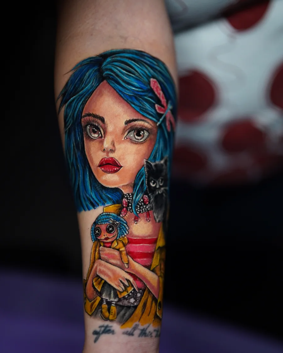 A colorful tattoo of a large-eyed girl with turquoise hair holding a small doll against her chest.