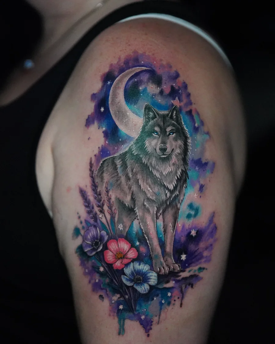 Alternate view. A wolf standing below a crescent moon, surrounded by purple and blue watercolor-like color and small flowers.