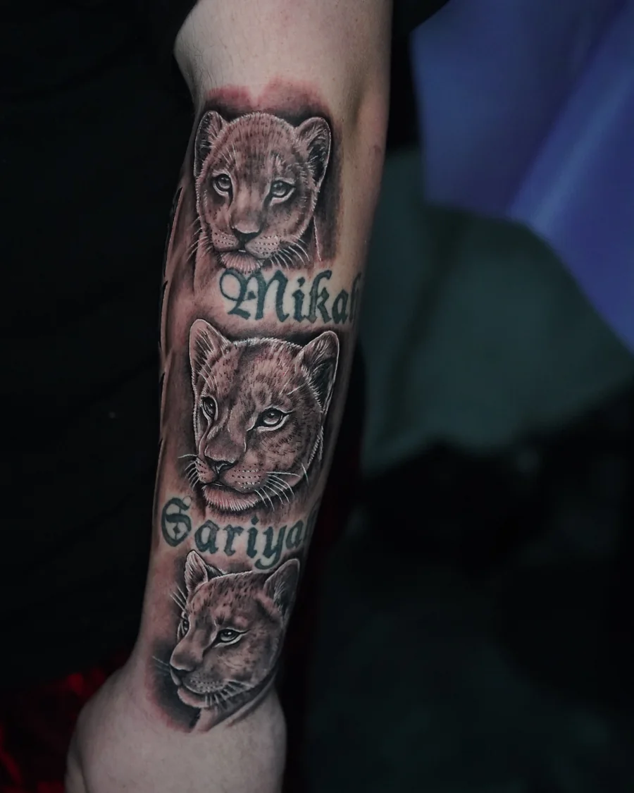 Three lion cub portraits stacked along the forearm with names between the faces.