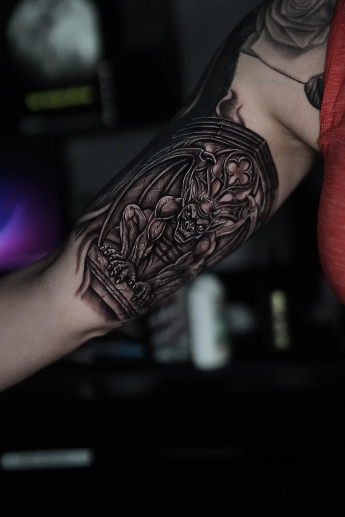 An ornamental coffin-shaped tattoo filled with flowers, leaves and fine decorative shading.