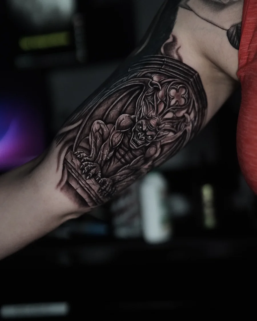 An ornamental coffin-shaped tattoo filled with flowers, leaves and fine decorative shading.