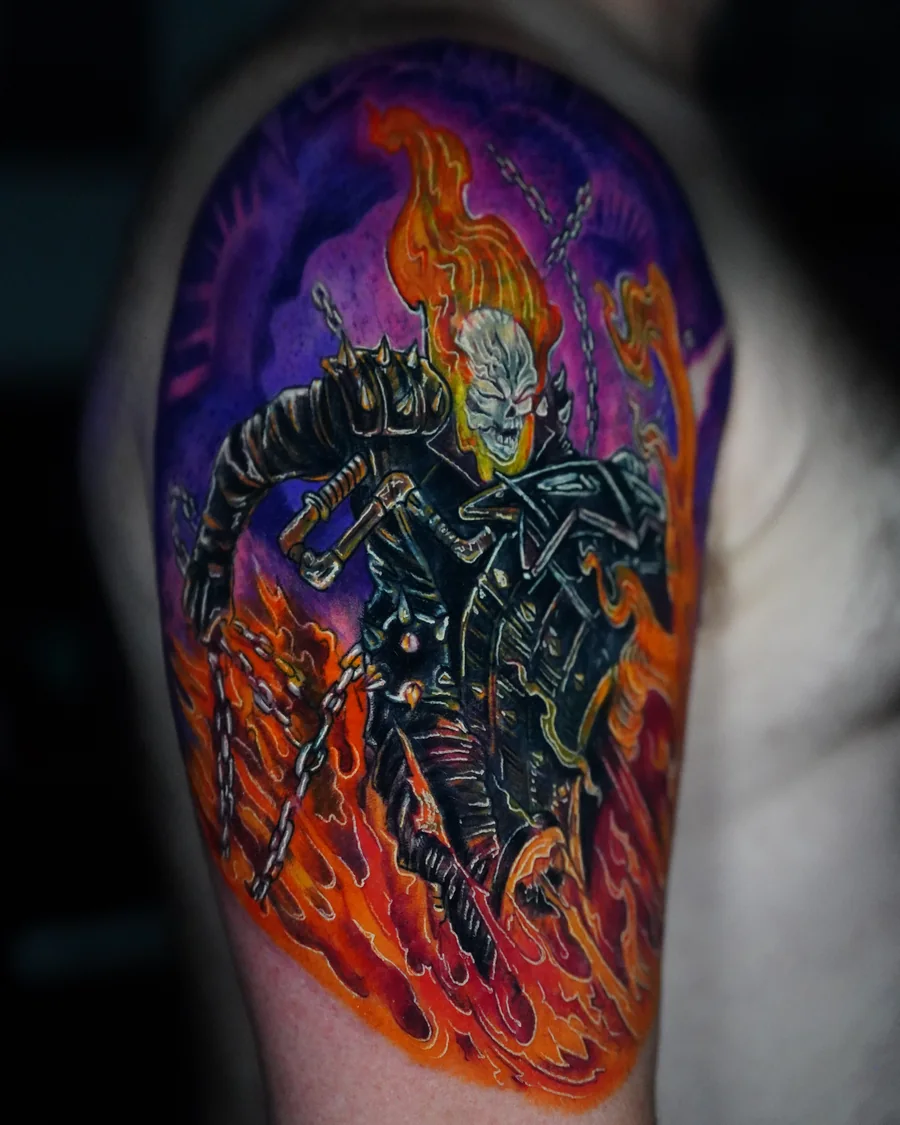 A flaming skull rider in a dark jacket with a chain, surrounded by vivid orange fire and a purple background.