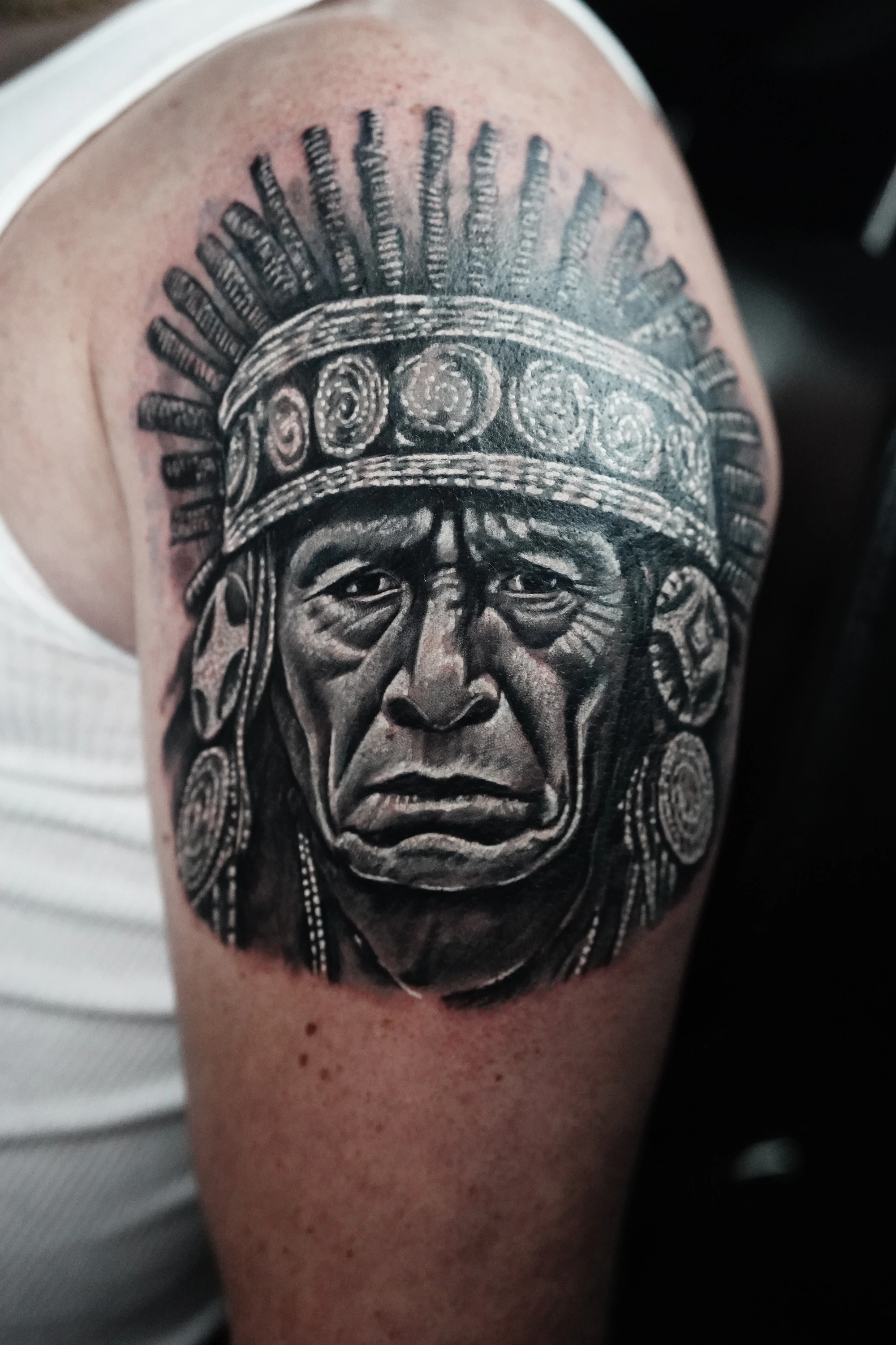 Portrait cover-up with facial texture and a detailed feathered headdress.