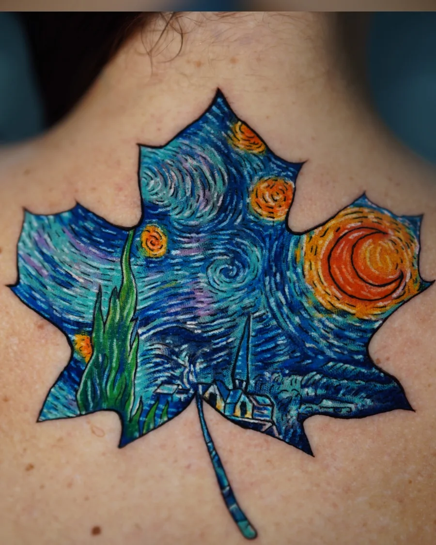 A maple leaf tattoo filled with a swirling night sky, blue brushlike marks, and golden stars.