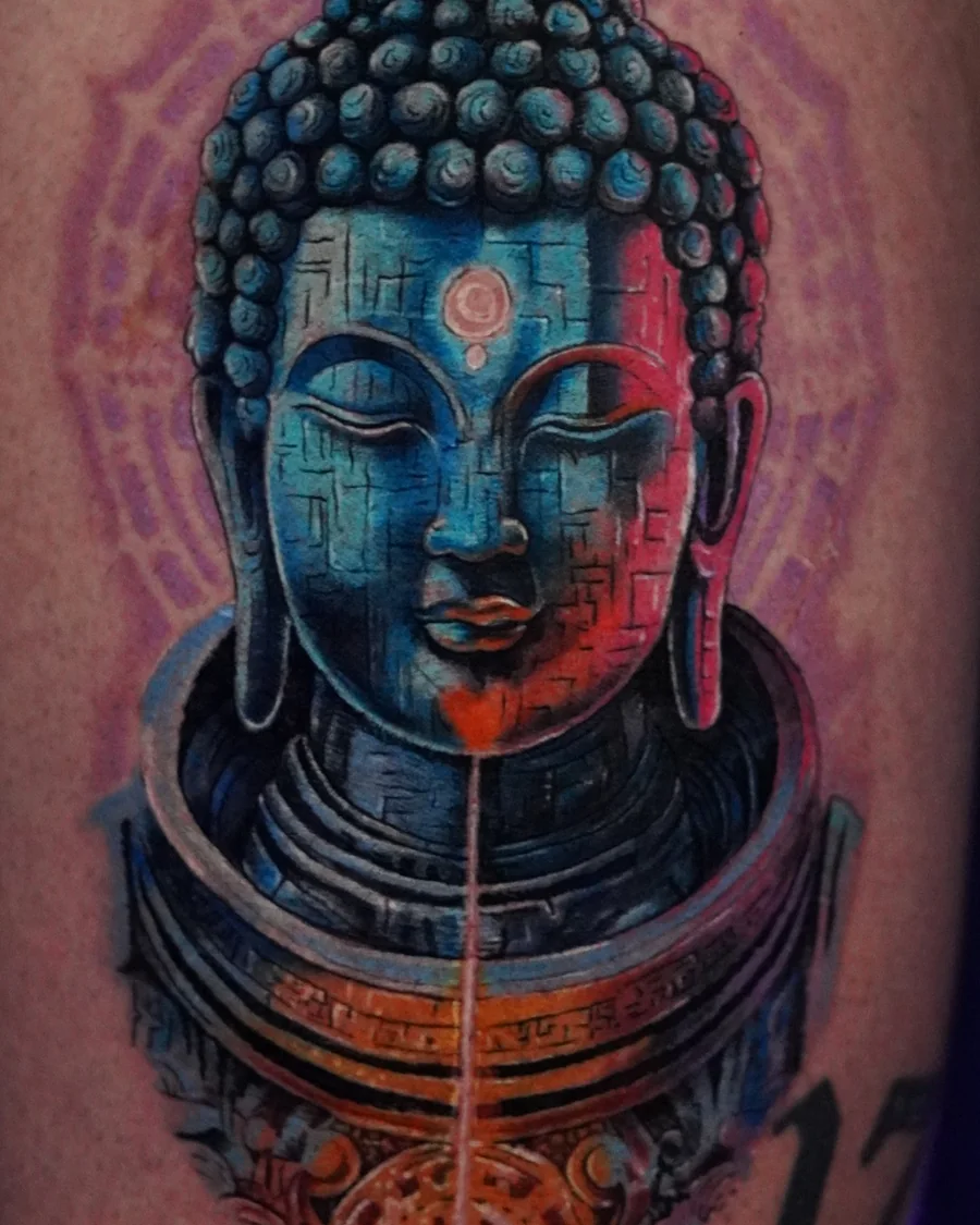 A colorful Buddha portrait tattoo built around turquoise, violet, and warm red highlights.