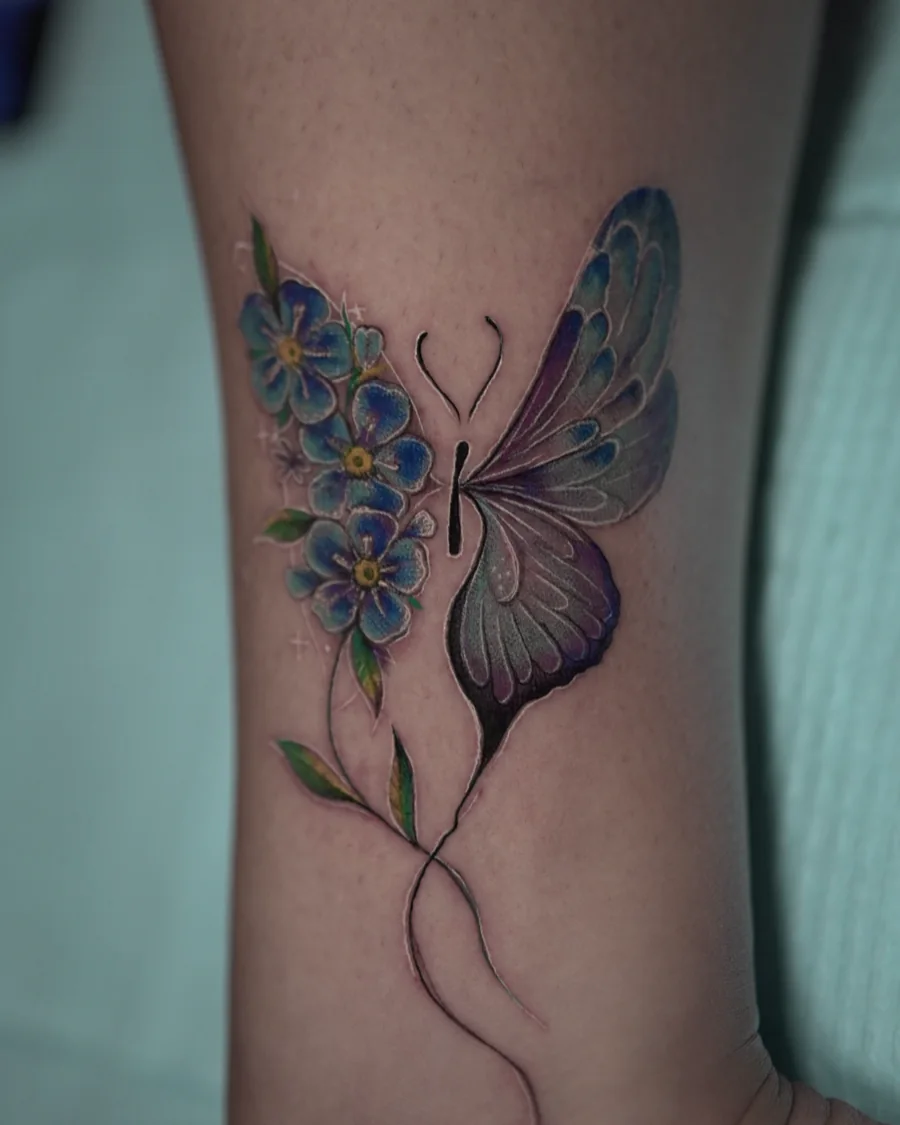 A purple butterfly wing paired with small blue flowers and a fine curved stem.